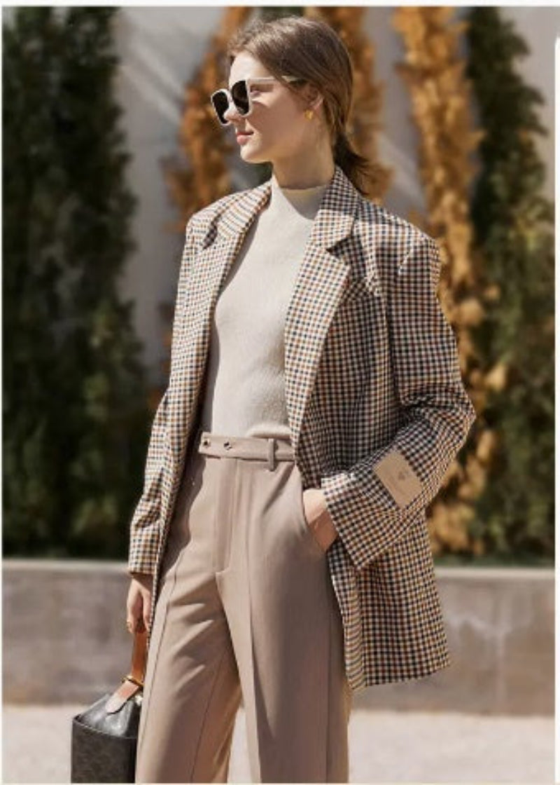Vintage plaid suit jacket for women with wide shoulders, perfect for casual and formal occasions.