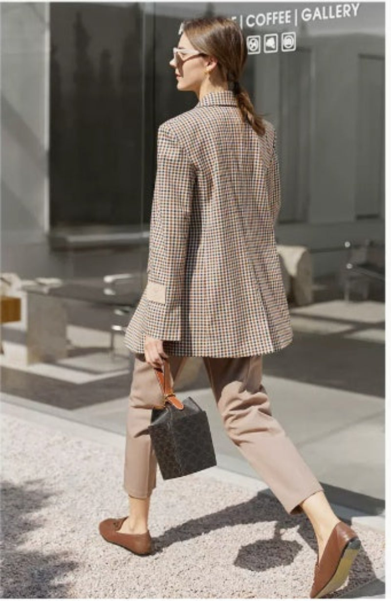 Vintage plaid suit jacket for women with wide shoulders, perfect for casual and formal occasions.