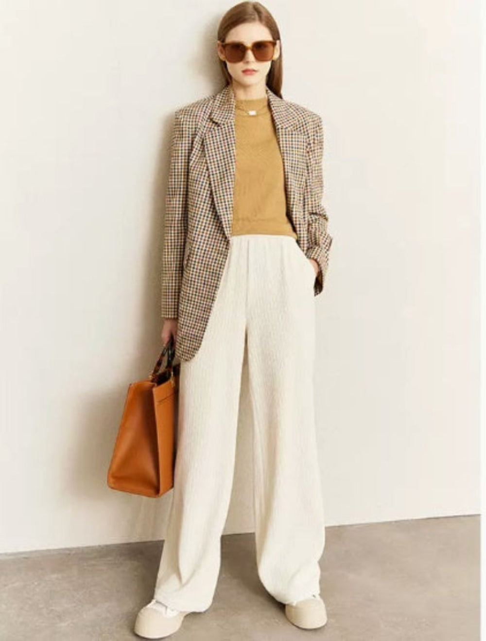 Vintage plaid suit jacket for women with wide shoulders, perfect for casual and formal occasions.