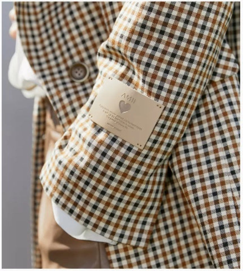 Vintage plaid suit jacket for women with wide shoulders, perfect for casual and formal occasions.