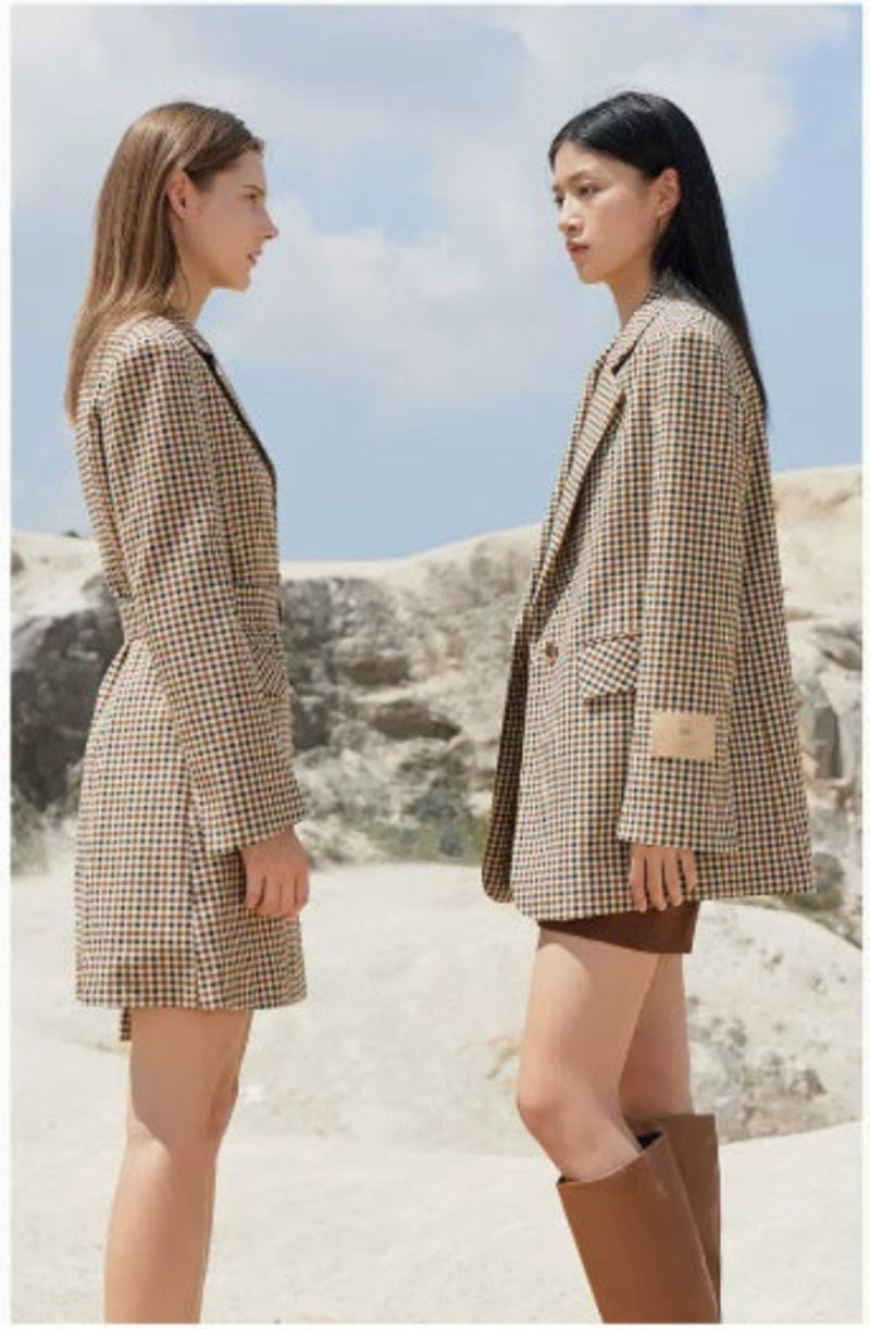 Vintage plaid suit jacket for women with wide shoulders, perfect for casual and formal occasions.