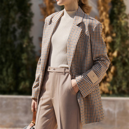 Vintage plaid suit jacket for women with wide shoulders, perfect for casual and formal occasions.